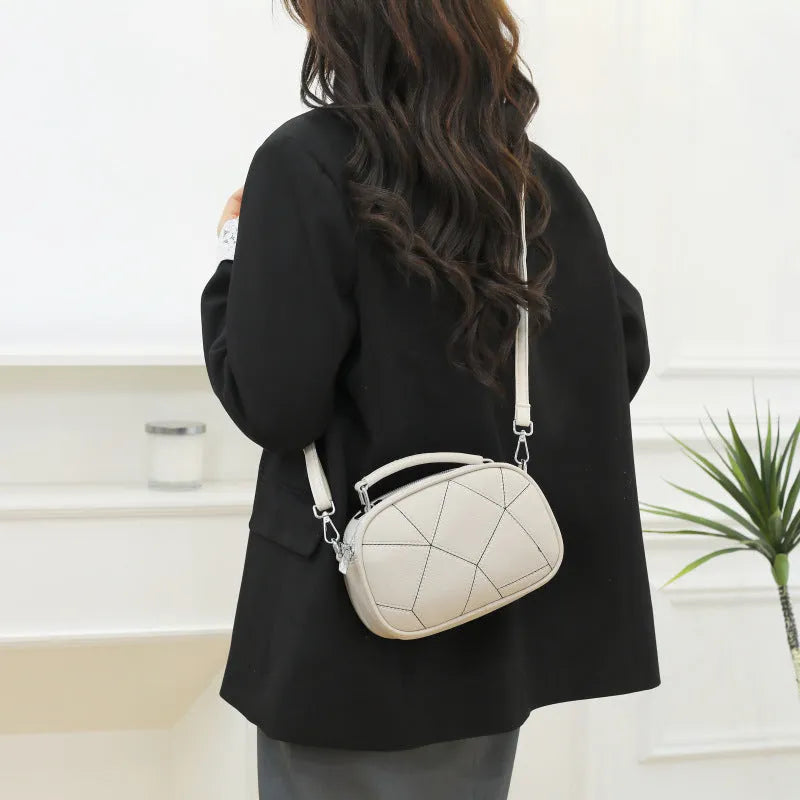 Round women's PU leather patchwork small bag with three-layer design and stitching detail