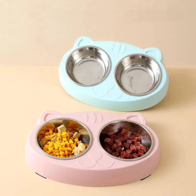 Blue macaron-shaped plastic pet feeder tray with two bowls for cat or small dog food and water.