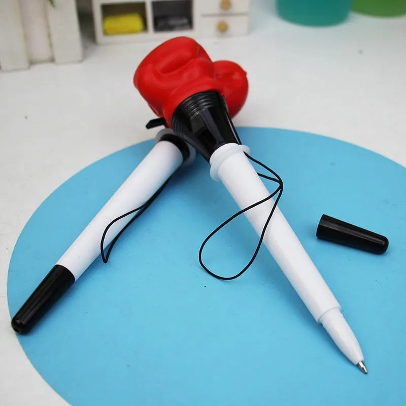 Four black pressure relief pens with boxing press ejection fidget mechanism and 0.7mm tips.