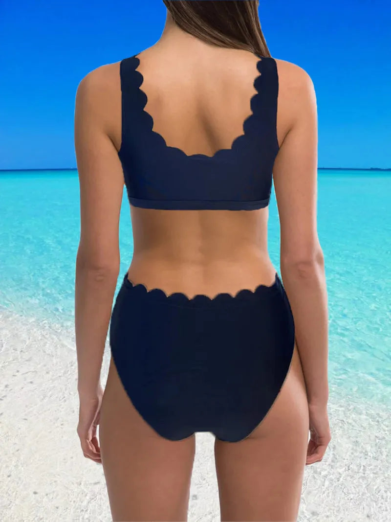 Women's high-waisted split swimsuit in polyester fabric available in red, black and blue colours