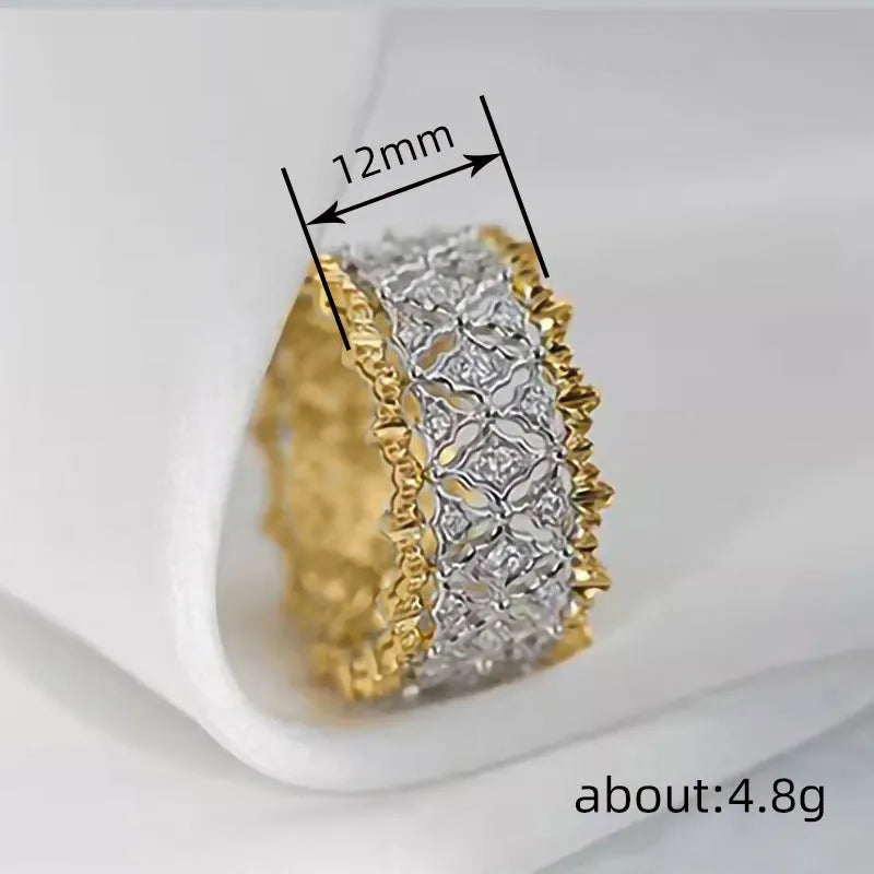 Geometric zircon ring with two-tone gold and silver electroplated finish on a copper band.