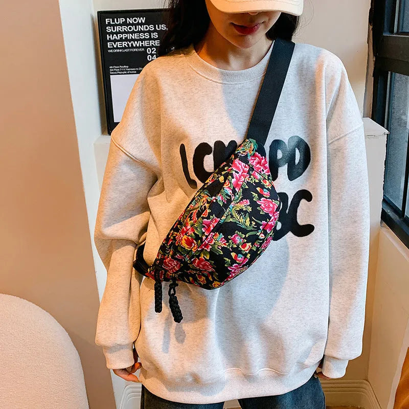 Women's western style waist bag with big flower design and contrast stitching in nylon material
