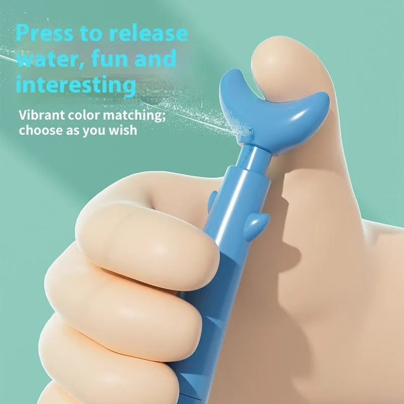 Shark water gun pen in blue plastic with press mechanism for water spray, on white background