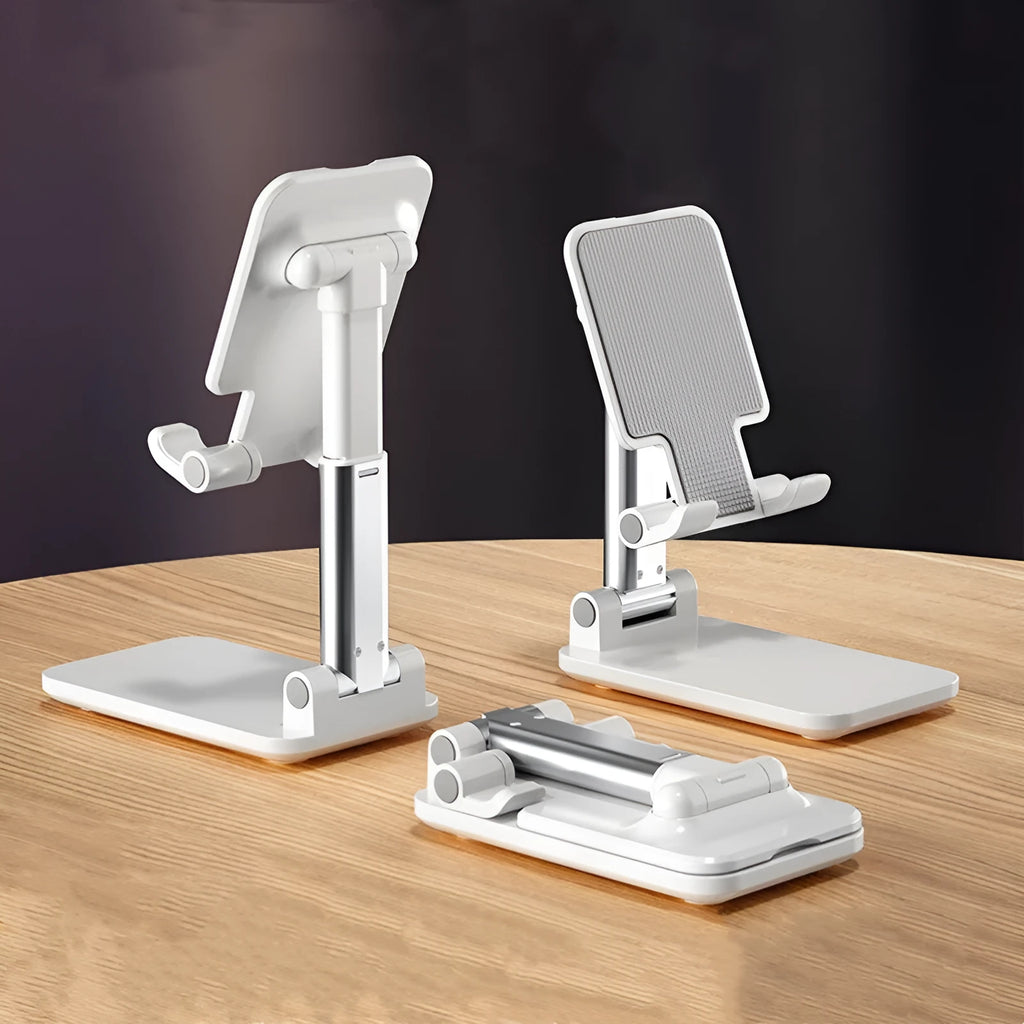 White folding telescopic mobile phone bracket holding a smartphone on a desktop