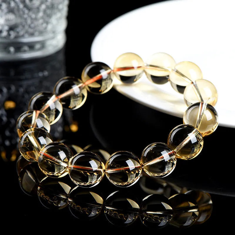 Natural citrine scattered beads ball bracelet showing polished stones and original design on wrist.