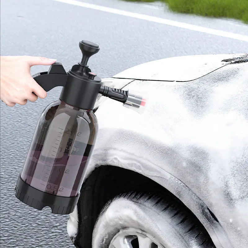 Black 2 litre foam watering can with hand-held sprayer and two nozzle attachments