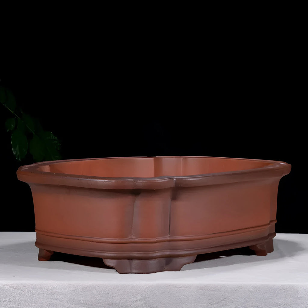 Large Chinese style purple clay flowerpot with antique jade finish and tree stump decoration
