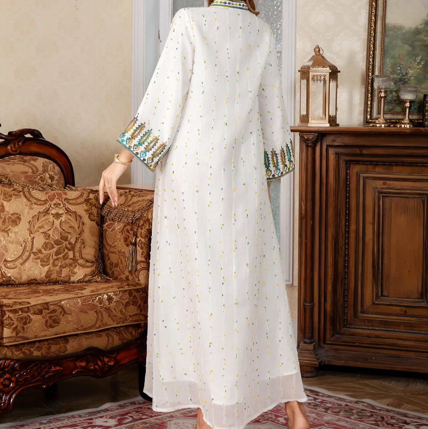 White long sleeve floor-length Arabic robe for women on a hanger
