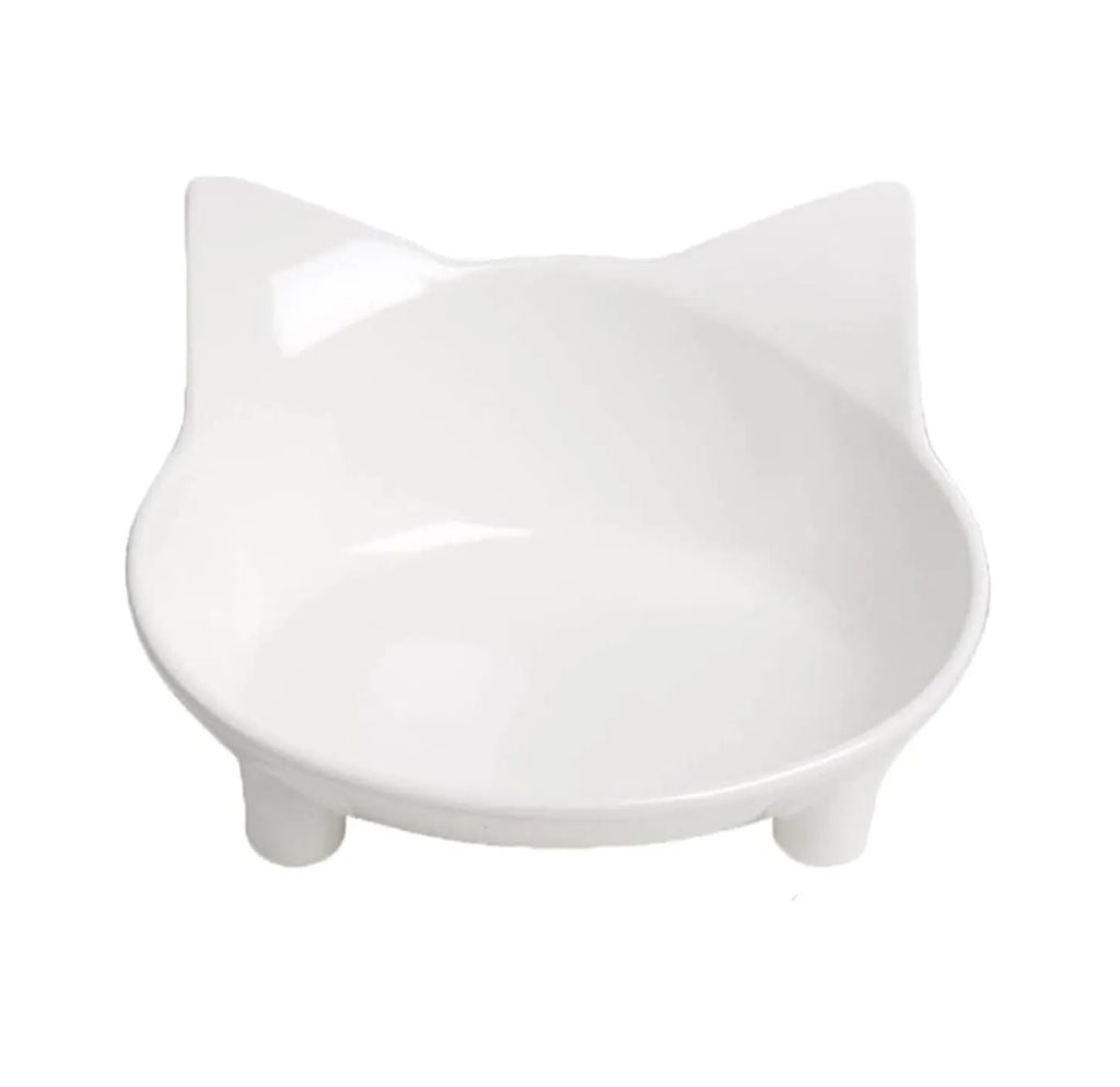 White shallow cat bowl with non-slip rubber base on a table.
