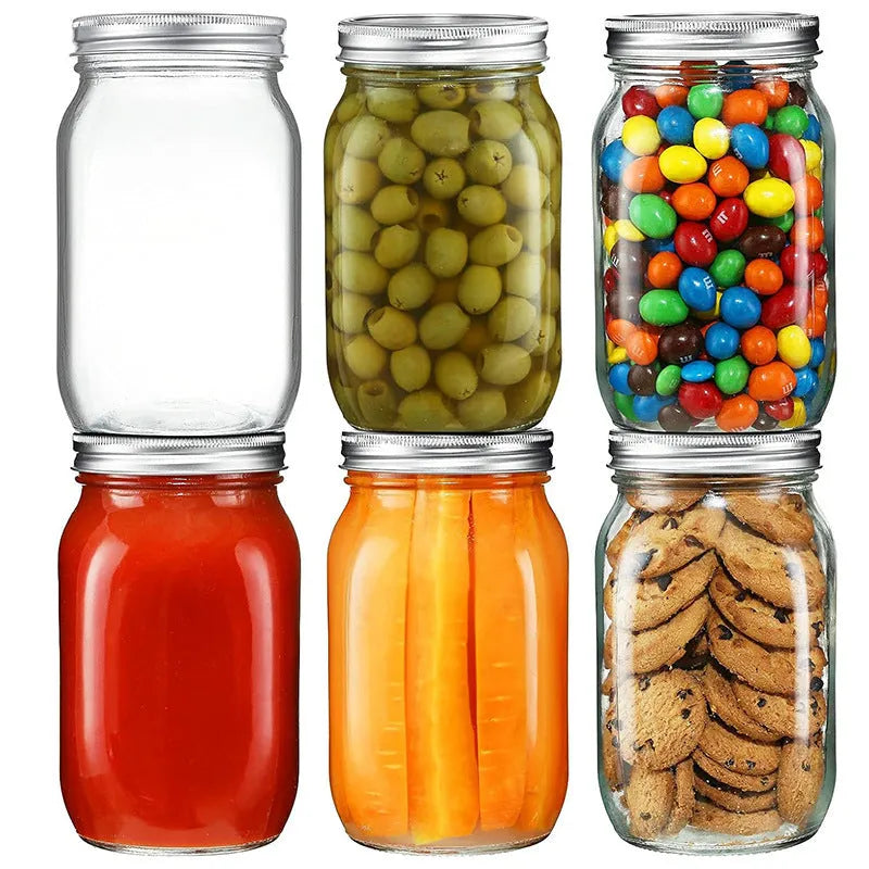 Set of six transparent 32oz glass bottles with airtight lids on a kitchen shelf