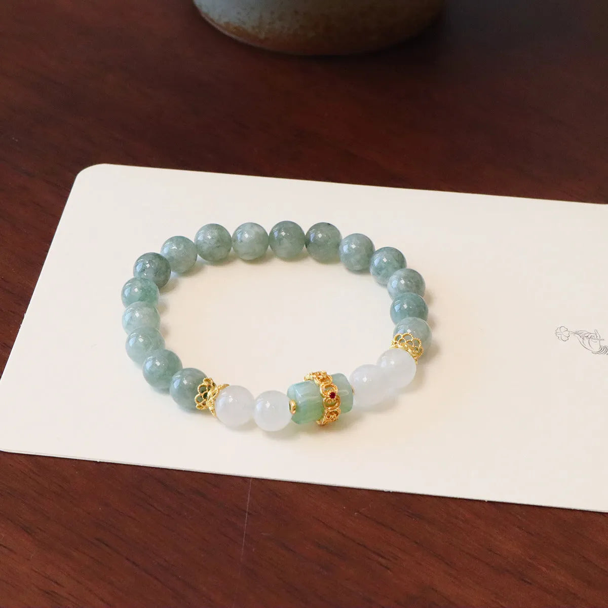 Women's Myanmar jade bracelet with Peace Buckle charm and crystal elements in geometric New Chinese style design