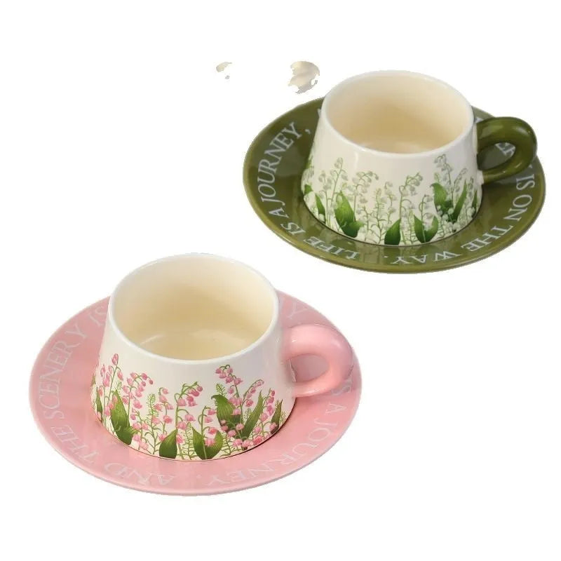 Ceramic coffee cup and saucer set for two in campanula floral design with stirring spoons