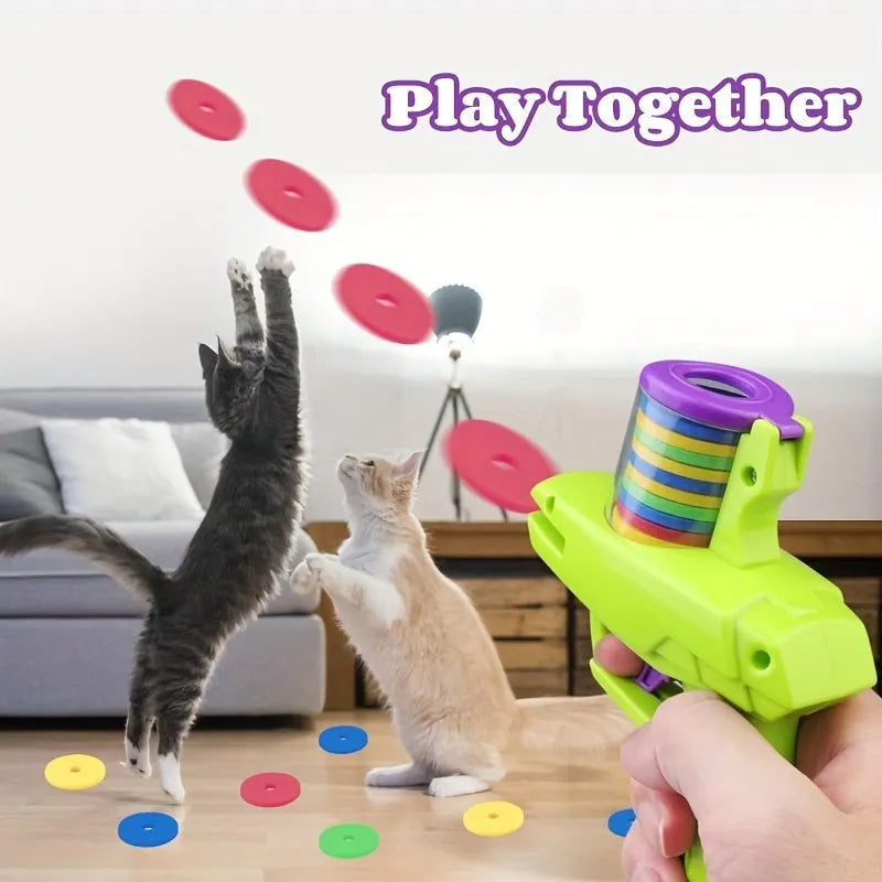 Interactive cat toy launcher with foam disc, available in green and purple colours
