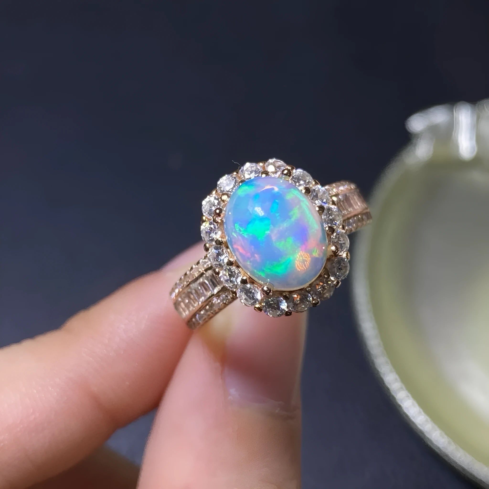 Handmade adjustable silver ring with a natural opal stone in rose gold plating.