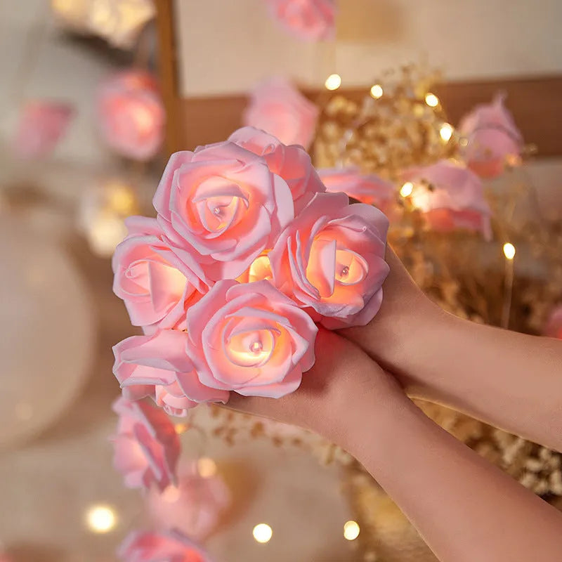 LED rose-shaped fairy light string with PV foam lamps on a 1.5m battery-powered cord for indoor holiday decoration.