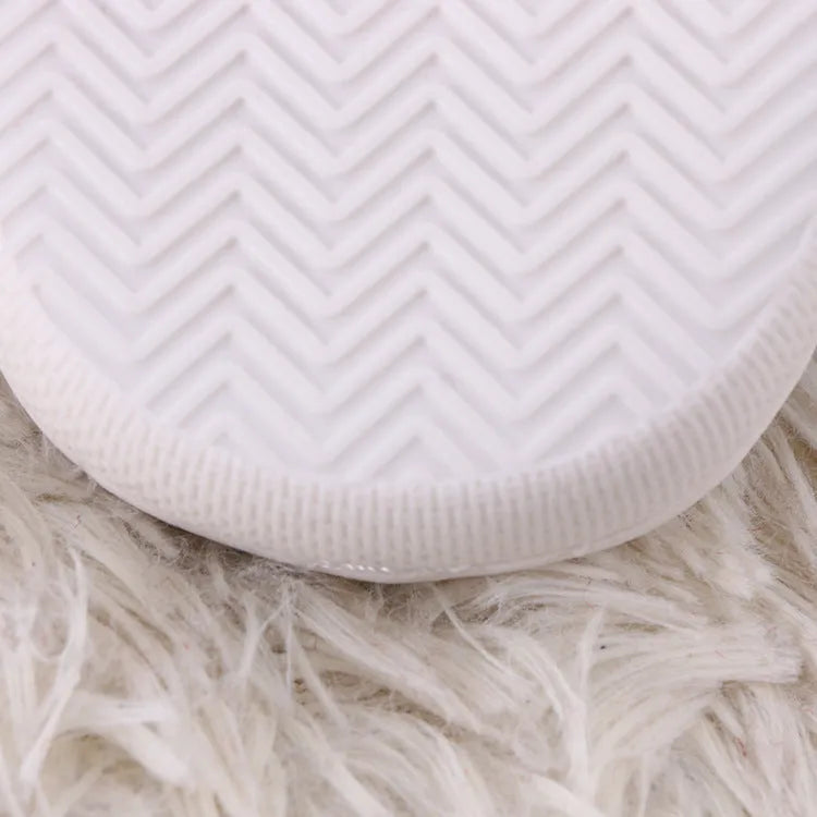 White cartoon pattern plush slippers with non-slip rubber soles