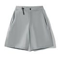 Men's quick-drying sports shorts in a solid colour with elastic waistband and 3D cut leg.