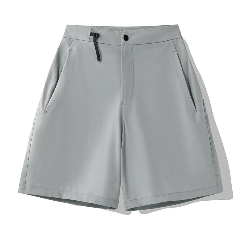 Men's quick-drying sports shorts in a solid colour with elastic waistband and 3D cut leg.