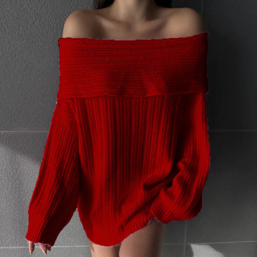 A woman wearing a loose, long-sleeved acrylic pullover sweater in a neutral colour.