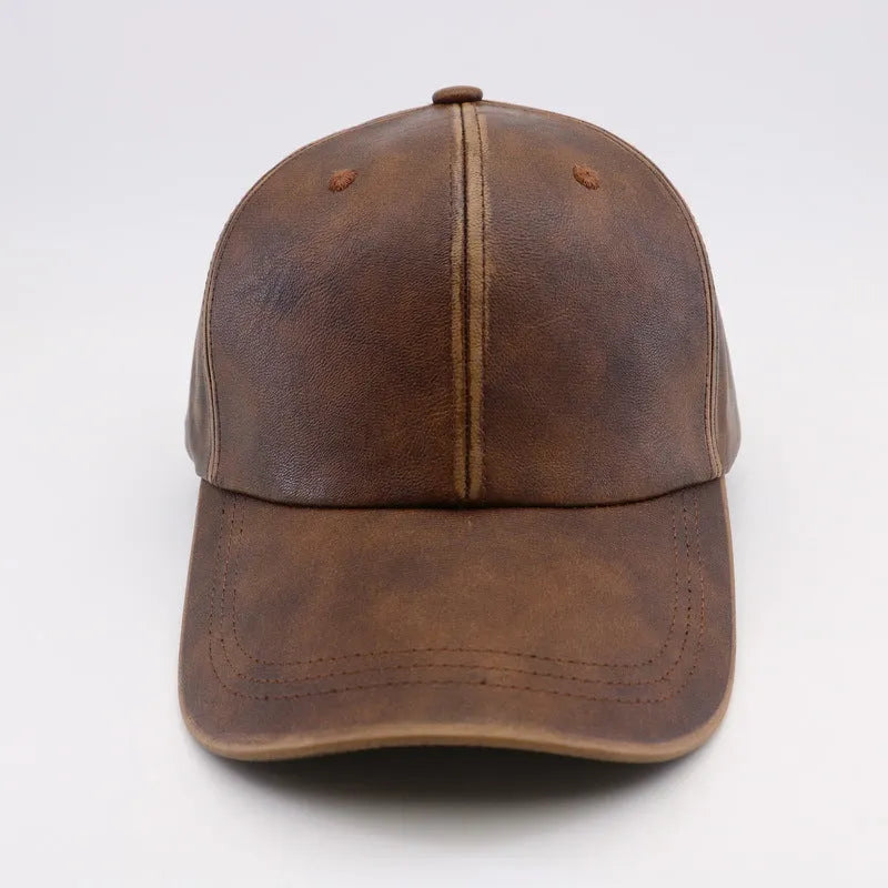 Washed and worn PU baseball cap with hard top peak, adjustable dome crown, brown colour, street travel fashion