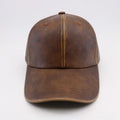 Washed and worn PU baseball cap with hard top peak, adjustable dome crown, brown colour, street travel fashion