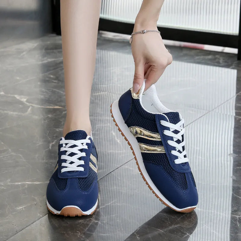 Blue women's casual tennis shoes with cross straps and non-slip rubber sole