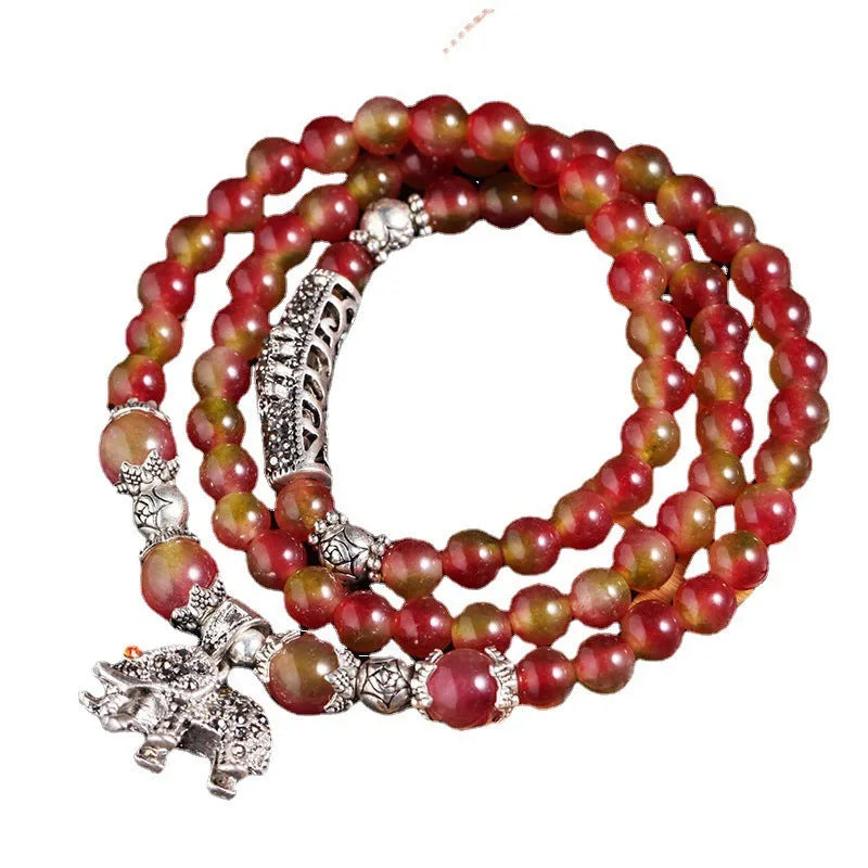 Watermelon crystal bracelet with Chinese knot design showing geometric natural stone beads