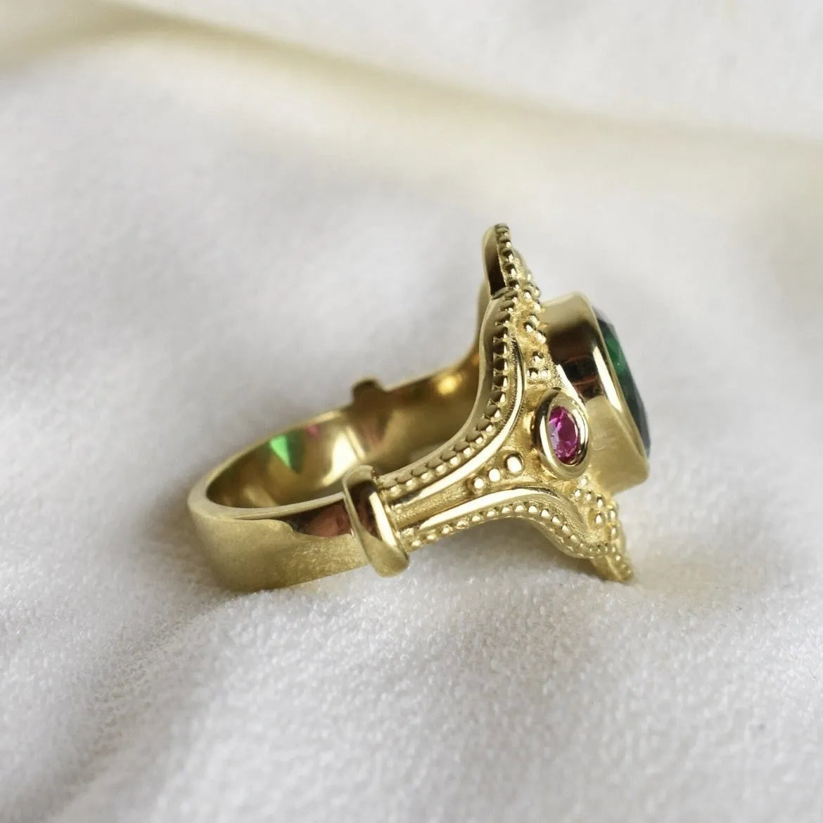 Golden geometric ins style women's alloy ring on a white background showing its electroplated finish.