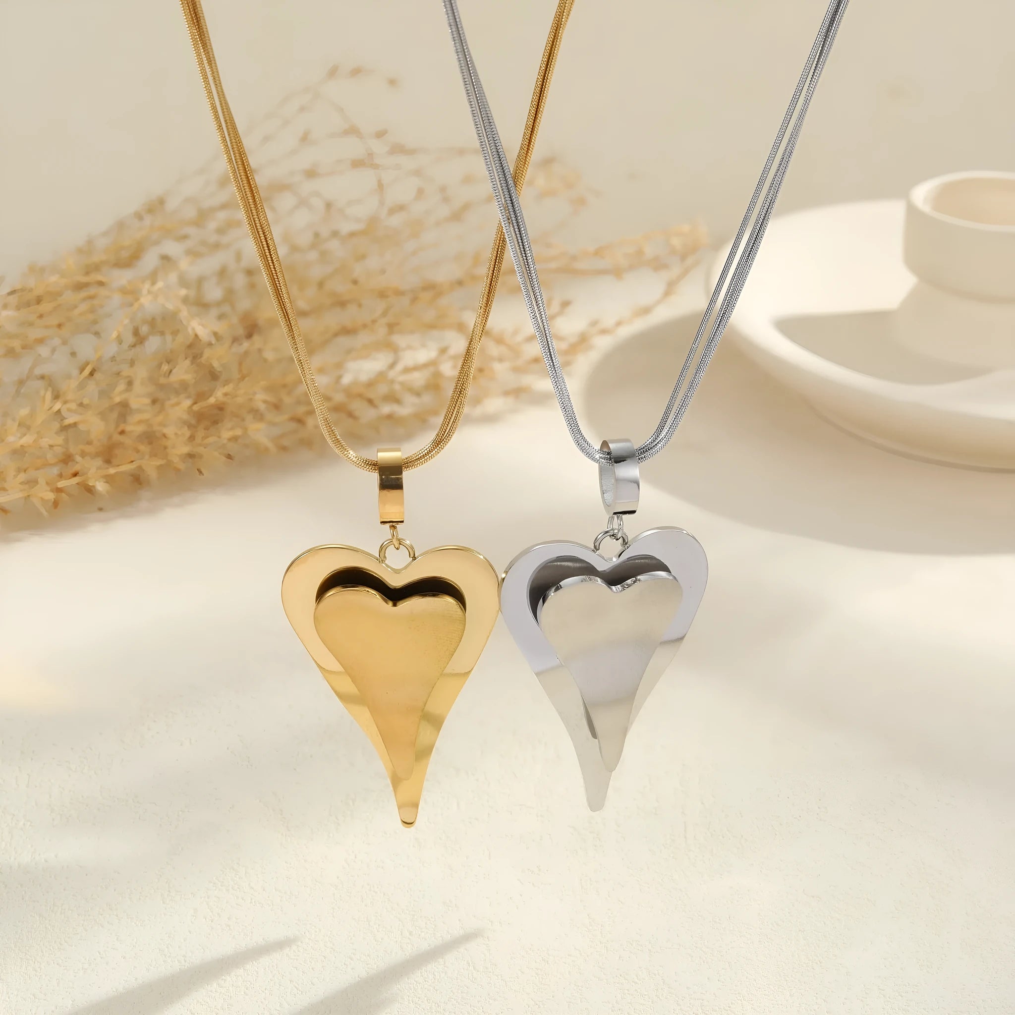Stainless steel double heart necklace with snake chain design and geometric pendant