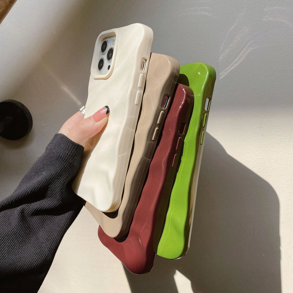 Soft solid colour wave pleated TPU protective case for Apple iPhone 17 series in burgundy on a white background.