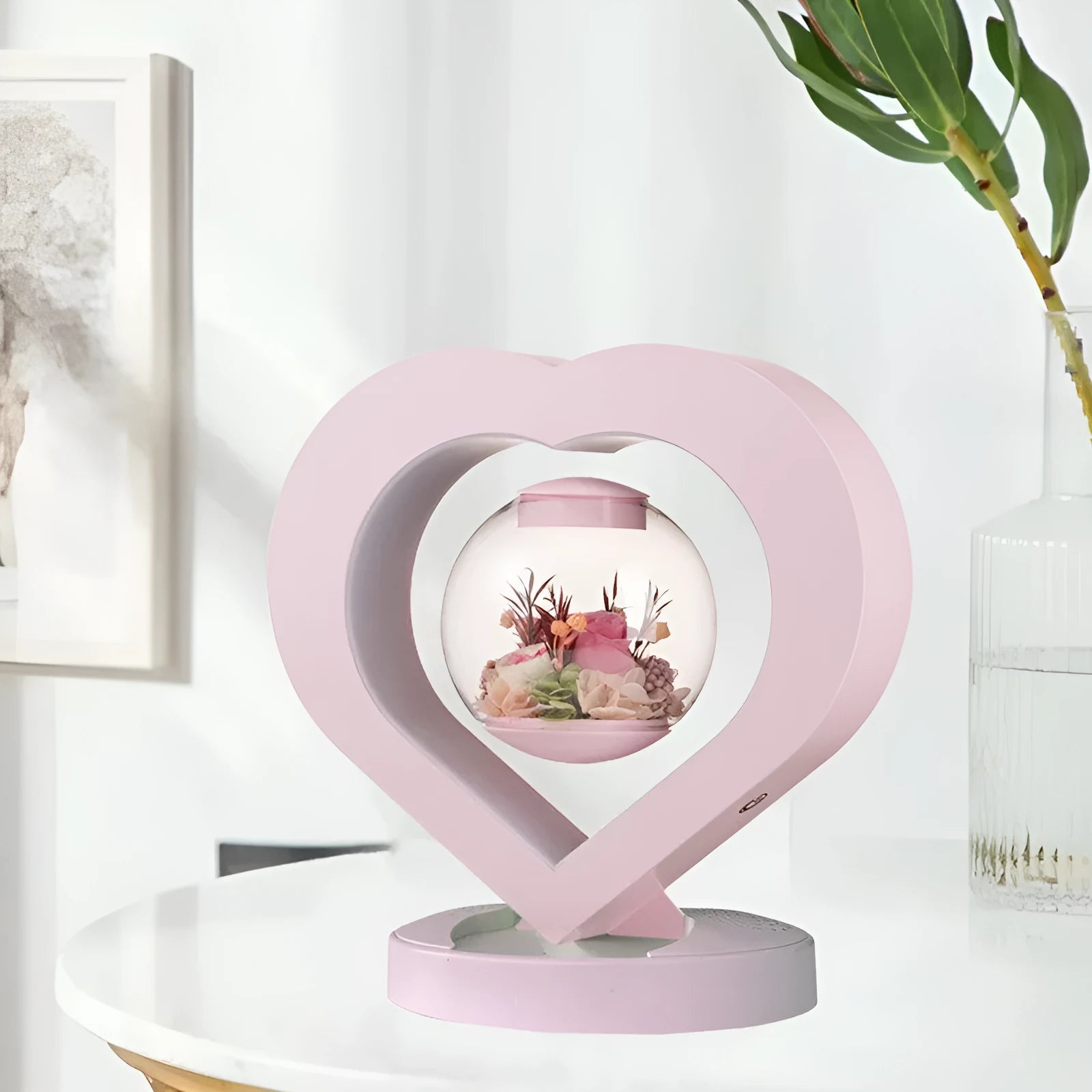 Pink preserved real rose ornament with optional base and Bluetooth audio speaker.