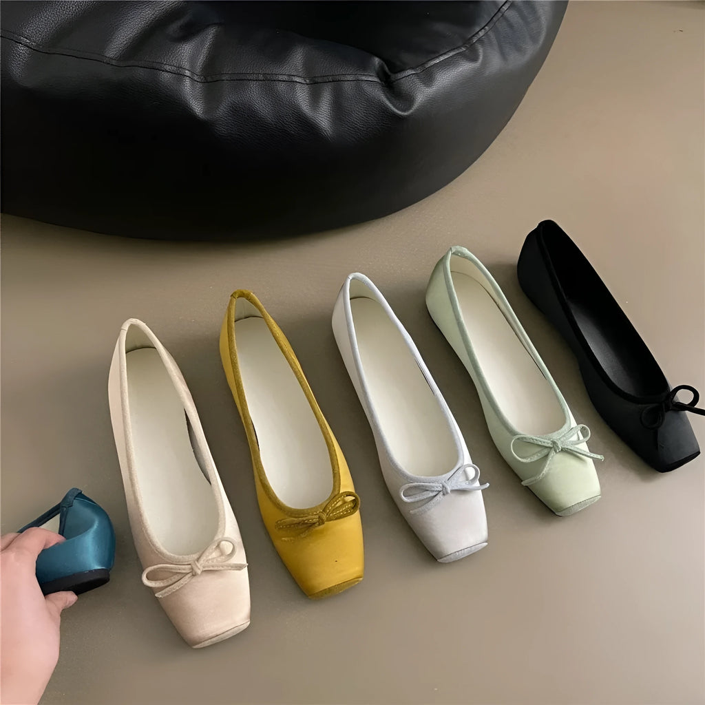 Women's satin shoes with hidden heels, square head and bow detail, available in six solid colours, sizes 35-40.