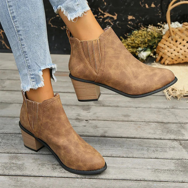 Women's black ankle boots with pointed toe and thick square heel slip-on design