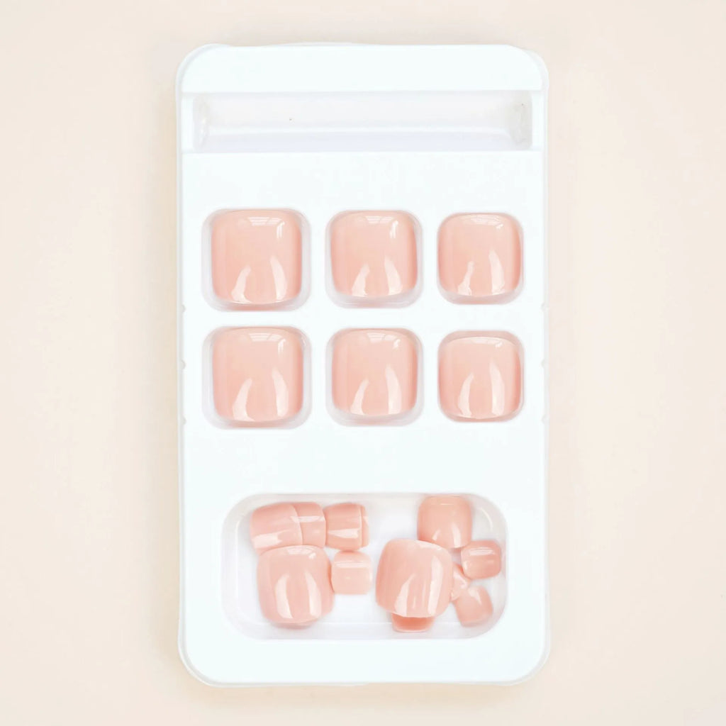 J-52 skin colour plastic toe nail stickers with glue for application.