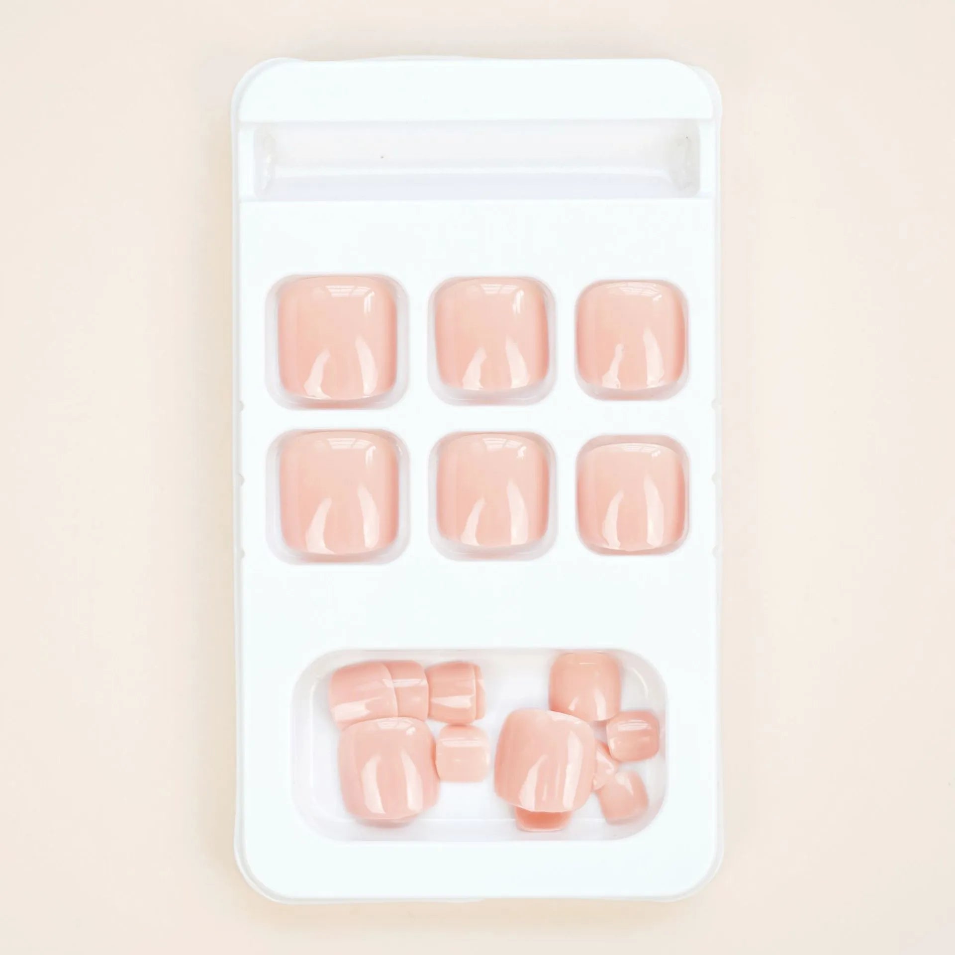 J-52 skin colour plastic toe nail stickers with glue for application.