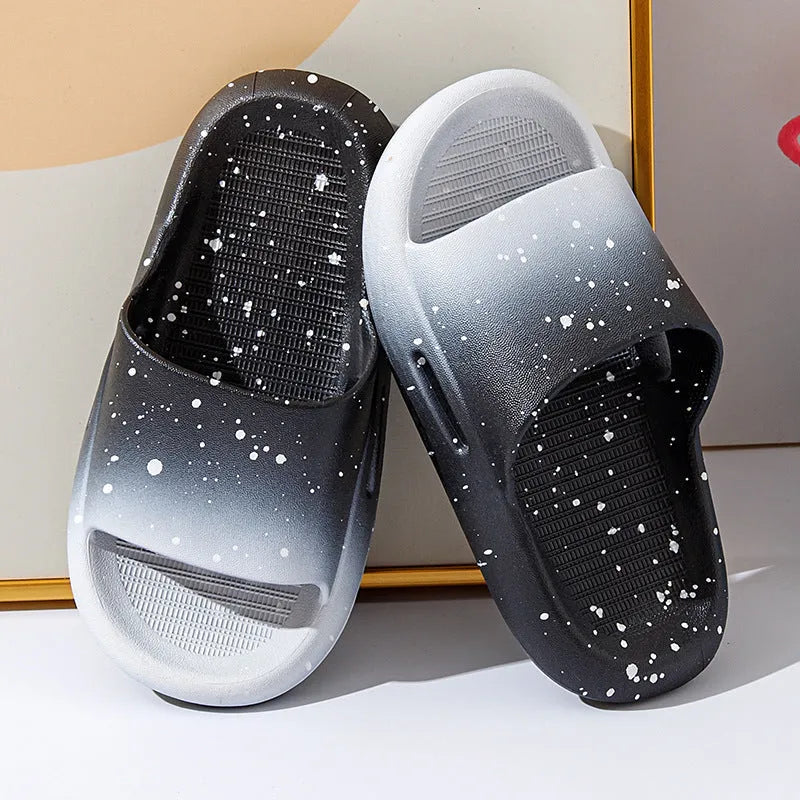 Gradient coloured PVC summer slippers for children on a plain background, showing the non-slip sole.