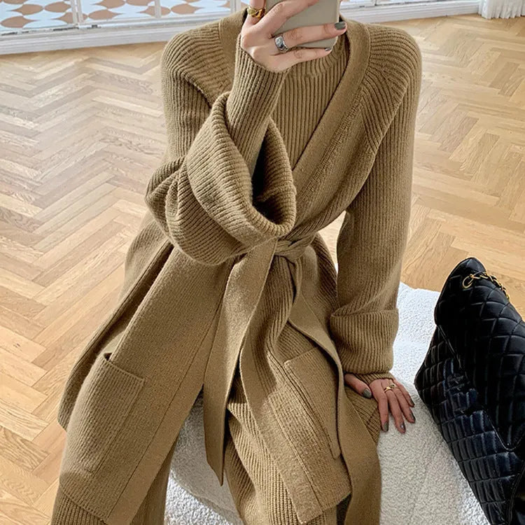 Women's apricot knitted three-piece set showing sweater, cardigan, and wide-leg pants with leather stitching detail.