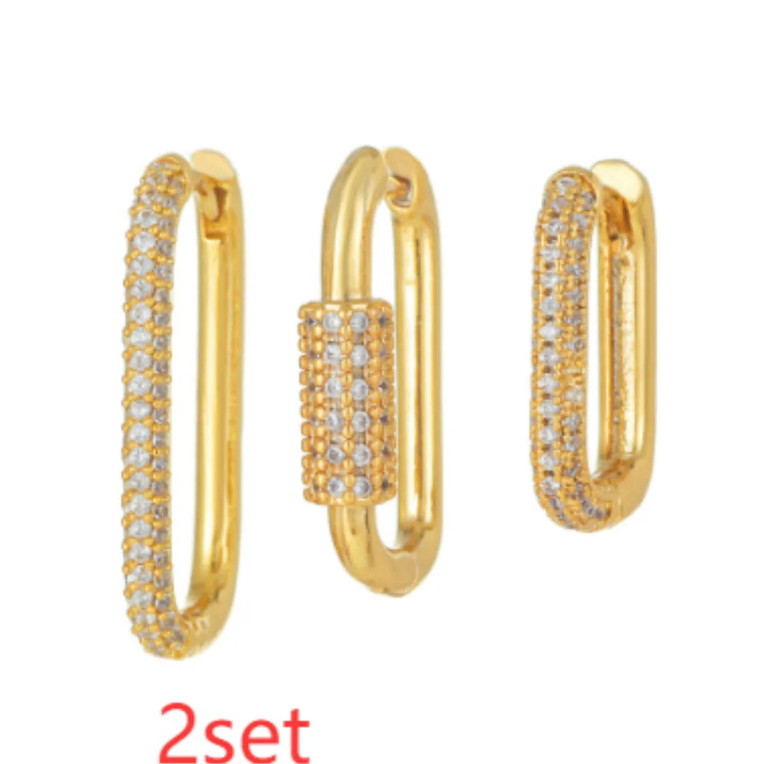 Three geometric copper ear clips with micro inlaid zircon stones in gold and white gold finishes