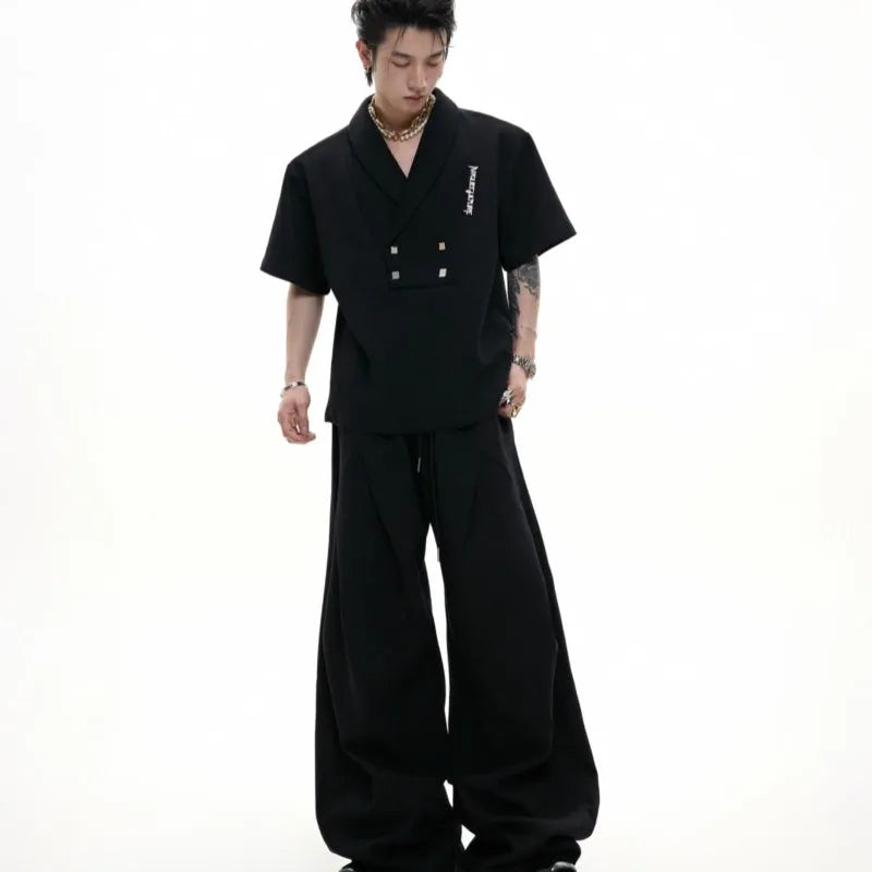 Men's dark grey V-neck cotton sports suit set with padded shoulders, metal embellishments, and matching shorts