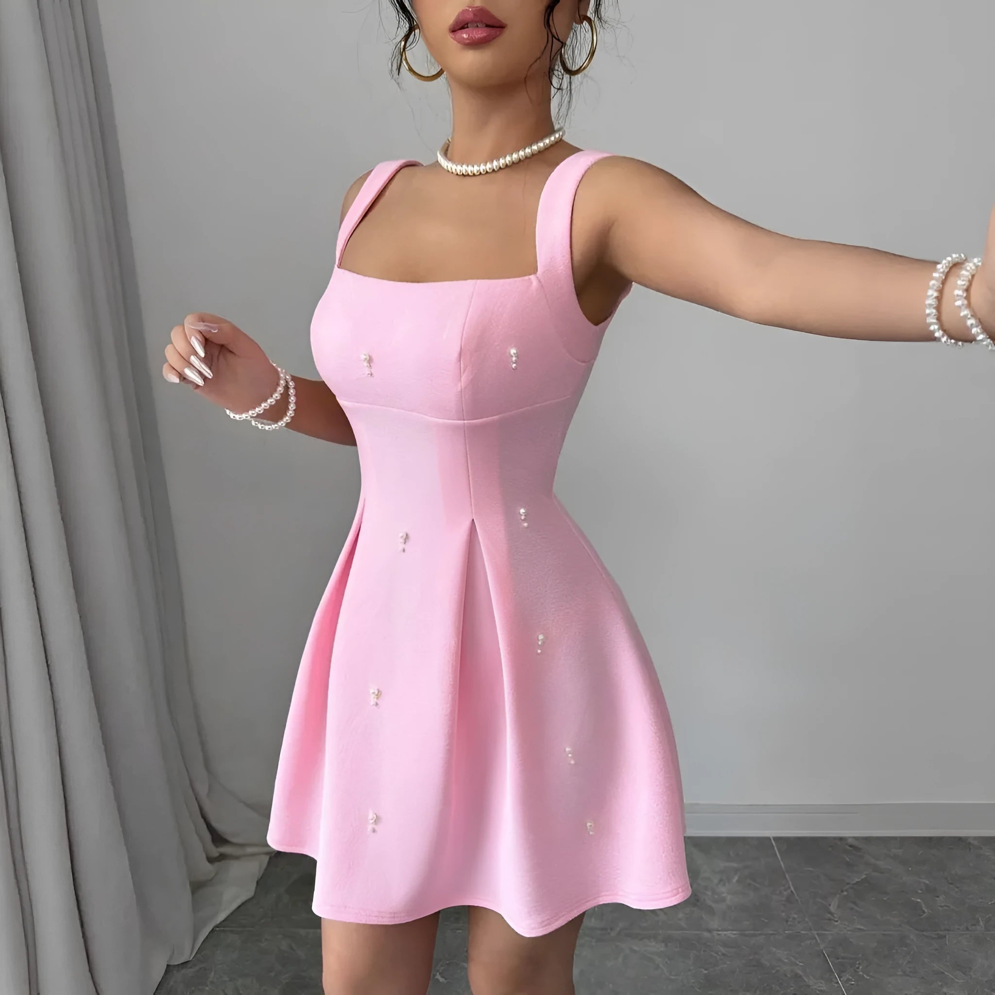 Pink high-waist suspender dress with A-line skirt and sleeveless design, made from polyester.