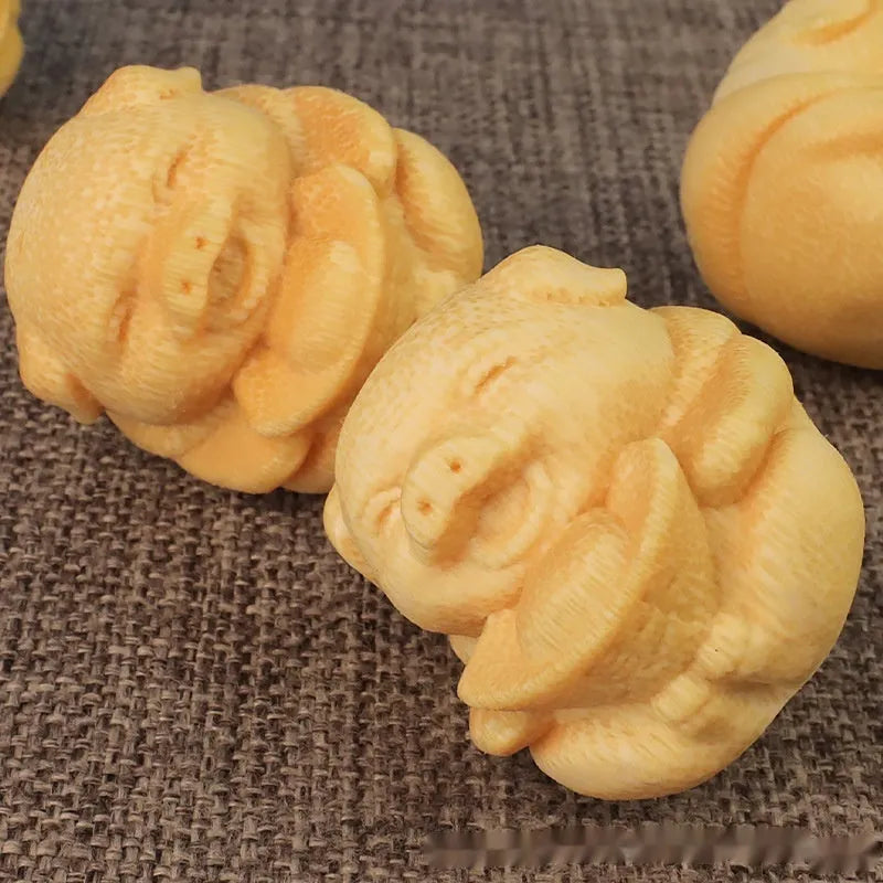 Handcrafted solid bamboo pig carving ornament with 4cm height and 3.5cm diameter dimensions