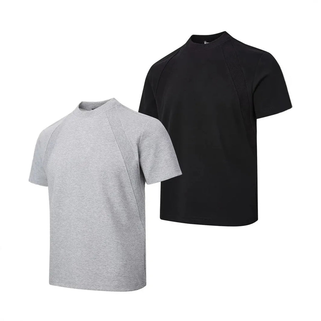 Men's loose black short sleeve top with textured air layer stitching on a grey background