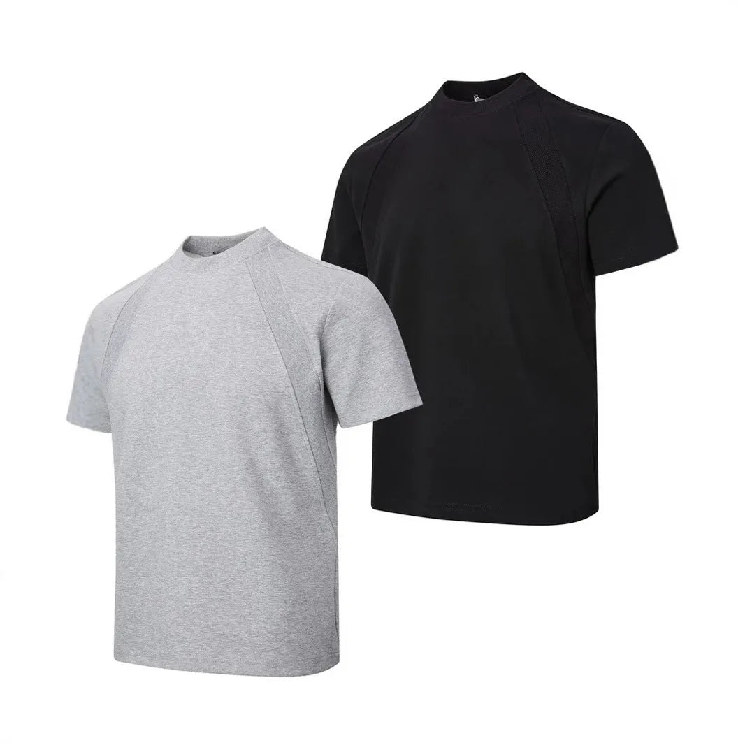 Men's loose black short sleeve top with textured air layer stitching on a grey background