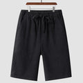 Man wearing beige loose-fit linen cropped shorts with an elastic mid waist.