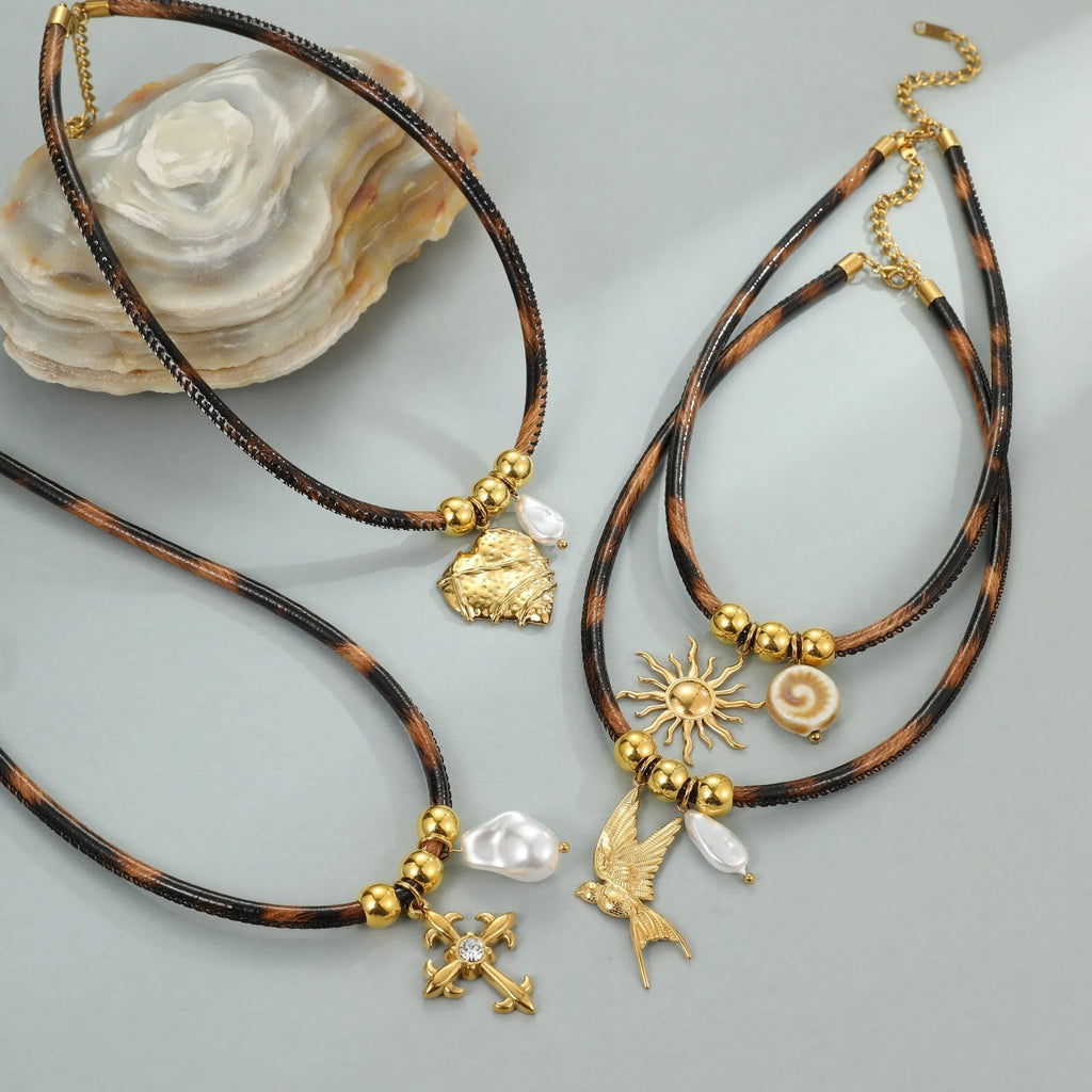 Women's stainless steel leopard pendant necklace with geometric design and gold-plated finish on adjustable chain