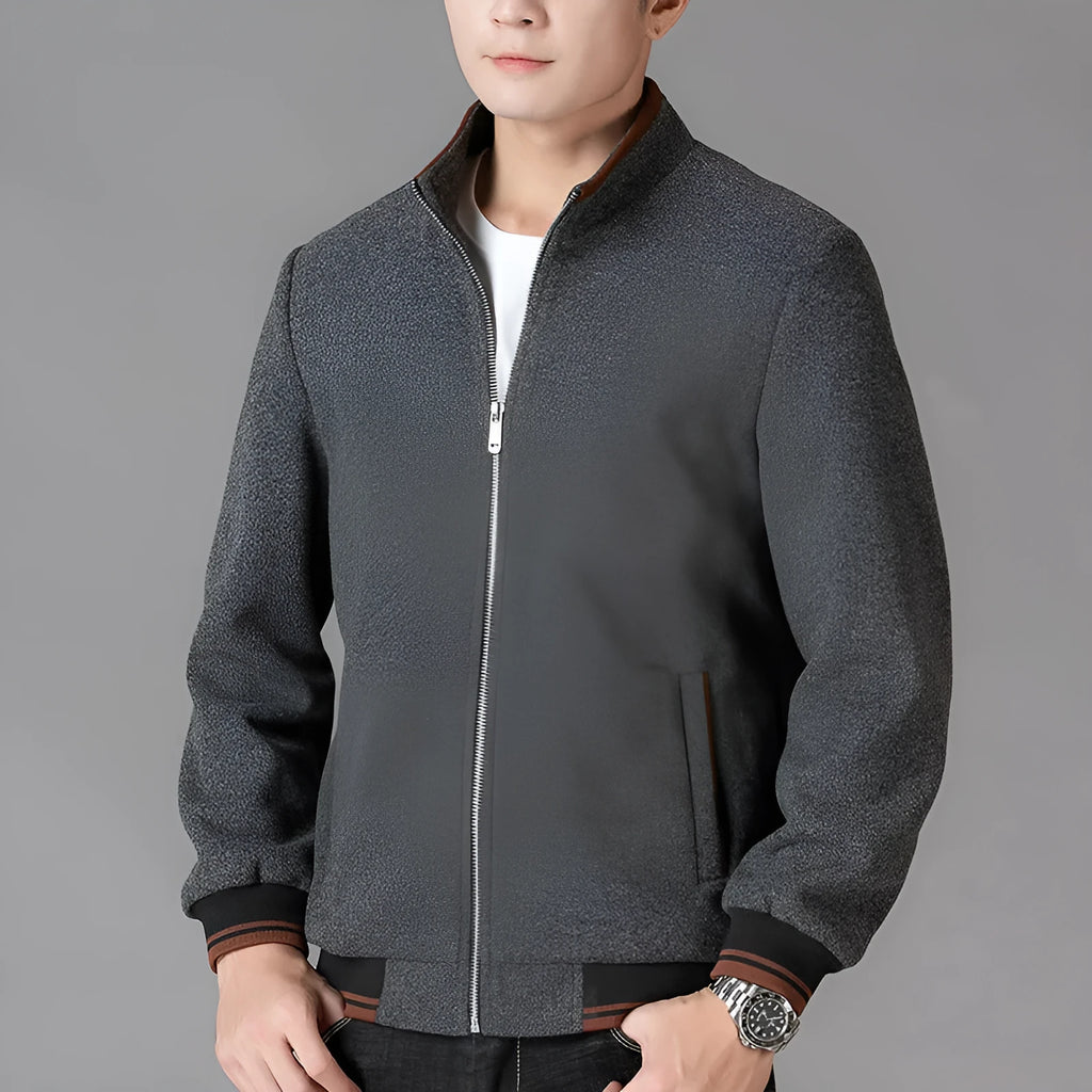 Men's grey polyester fleece jacket with long sleeves and side pockets shown in sports style