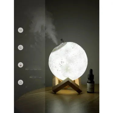 Wood finish spherical lunar humidifier and night light on a bedside table.