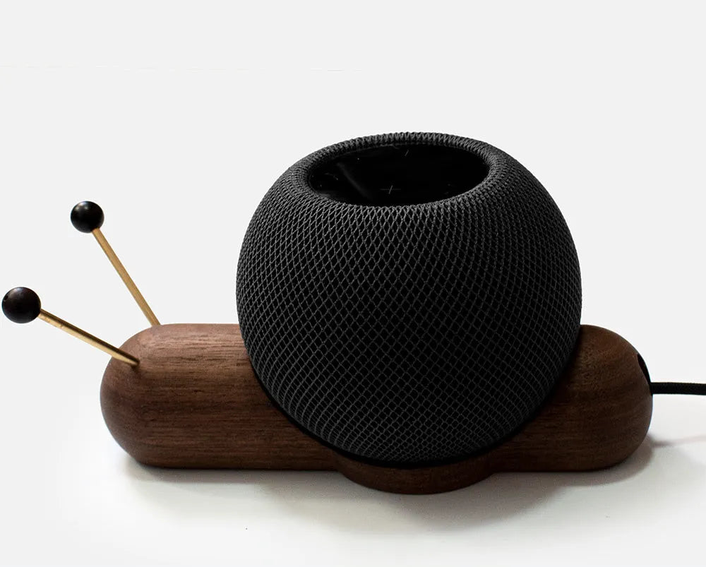 Khaki brown desktop non-slip bracket holding a smart Bluetooth speaker.