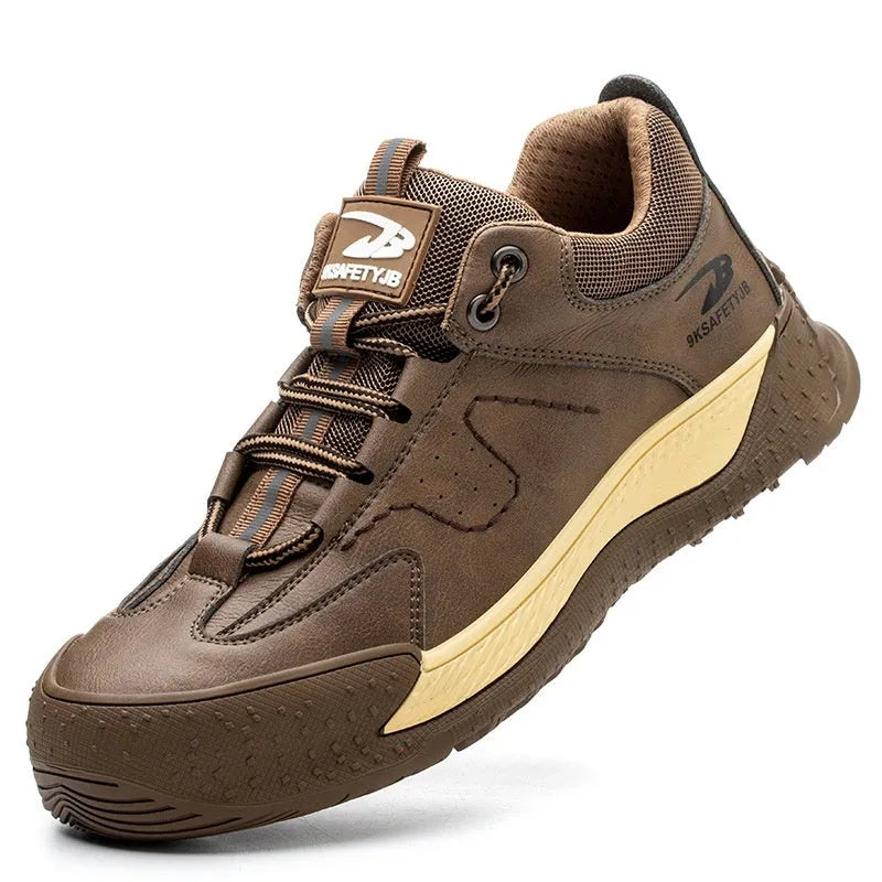 Men's black leather work safety shoes with rubber soles on a grey background