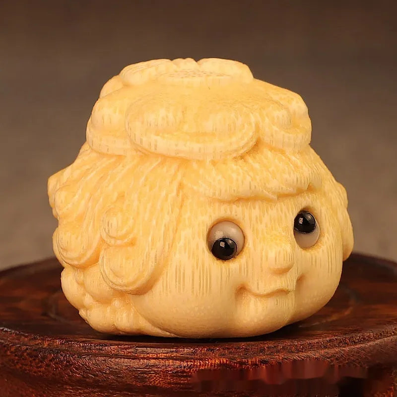 Solid bamboo golden toad princess ornament showing detailed hand carving and natural grain patterns